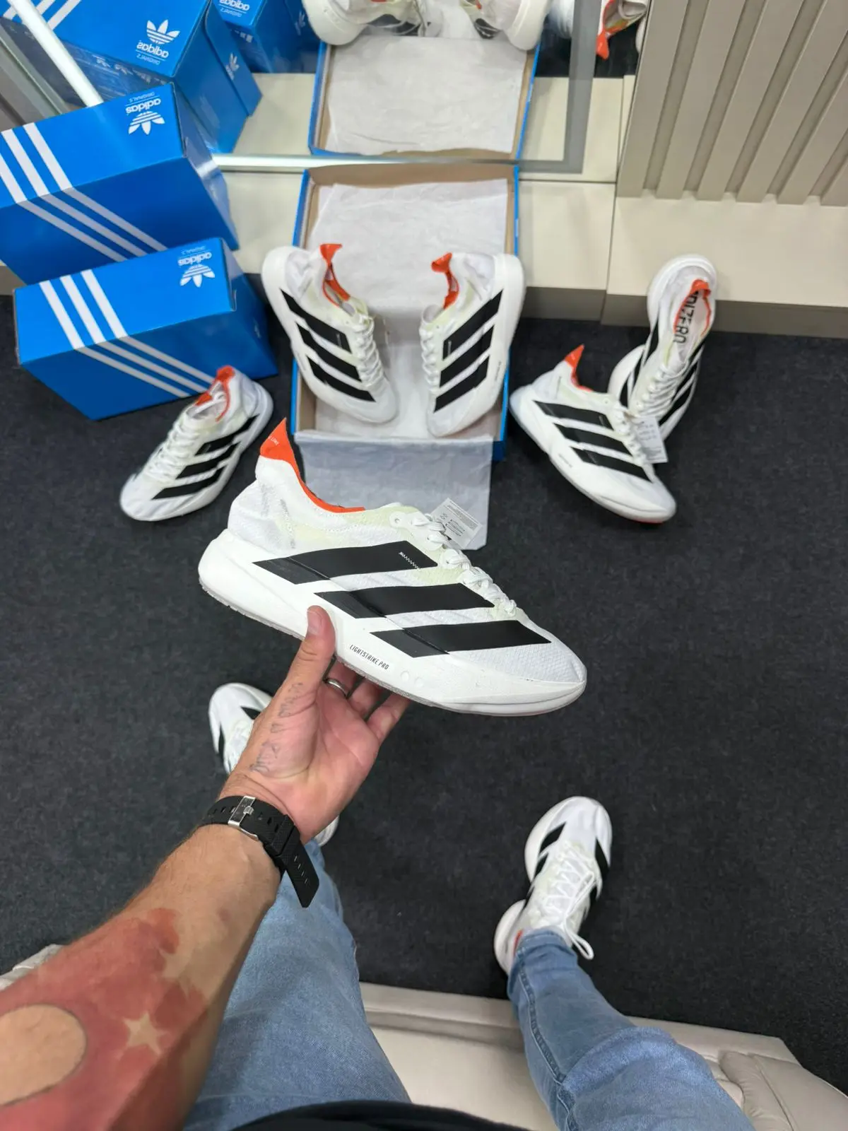 Adizero Evo Pro Branco Preto Laranja — foto principal